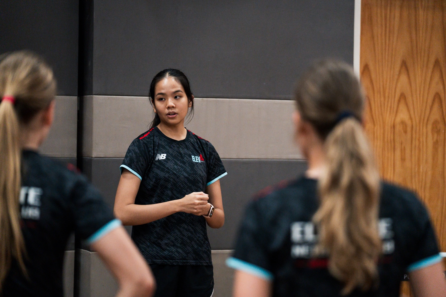Elevate coach guiding players